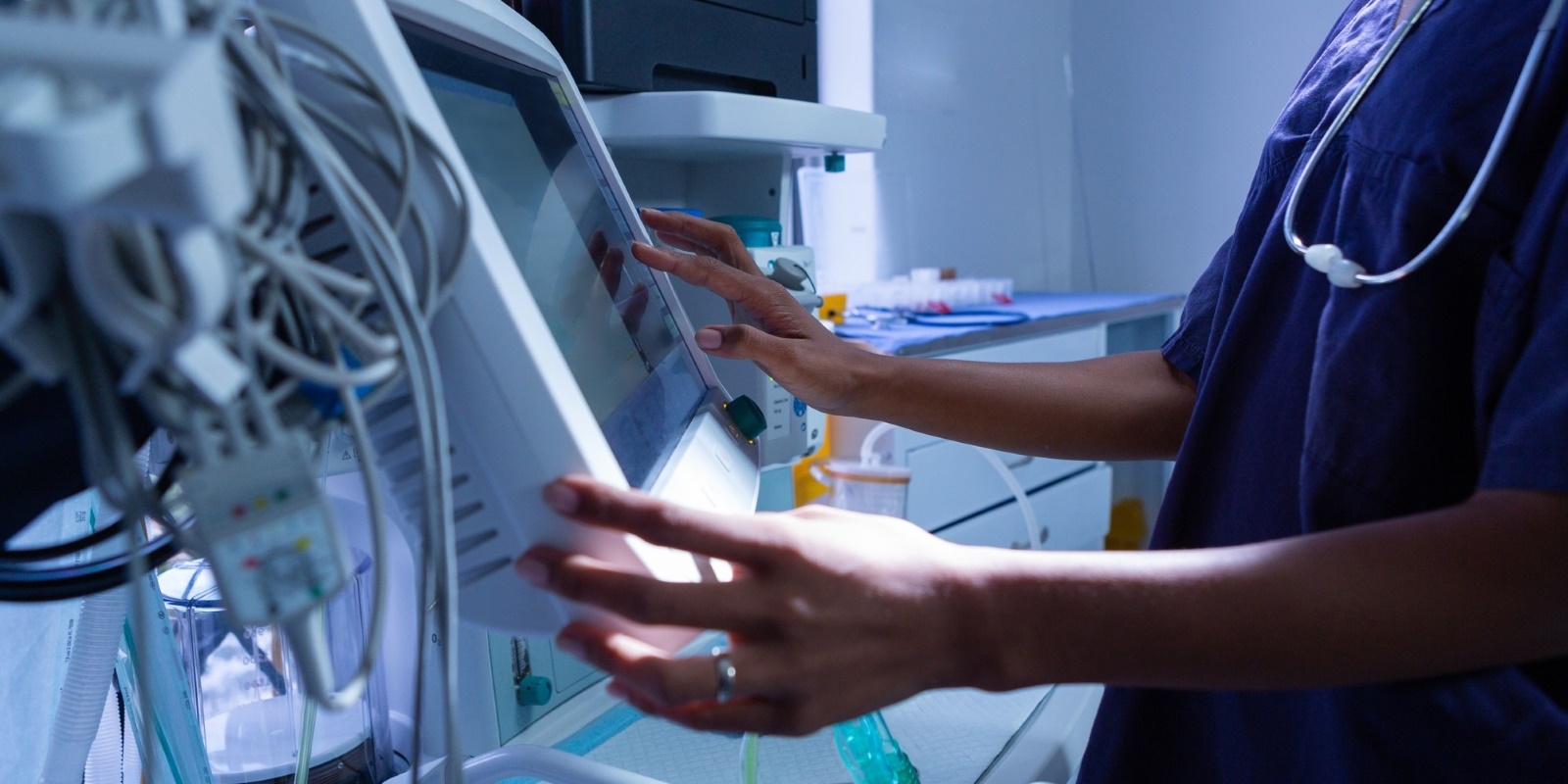 nurse using digital screen in medical center